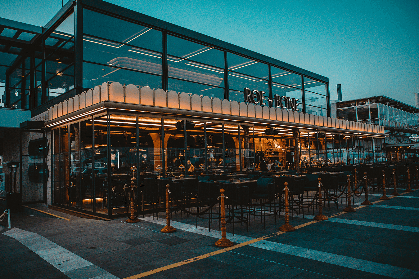 Open dining space at Roe + Bone with coastal-inspired design
